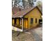 Angle shot of home showing covered porch, driveway, and garage with basketball hoop at 110 Casa Domain Ct, South Fulton, GA 30349