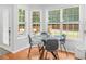 Cozy breakfast nook with lots of natural light and views of the private backyard at 144 Wyckliffe Dr, Locust Grove, GA 30248