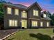 Stunning two-story home featuring a well-manicured lawn and a timeless stucco facade at 144 Wyckliffe Dr, Locust Grove, GA 30248