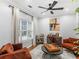 Stylish living room featuring neutral walls, hardwood floors, and designer touches at 144 Wyckliffe Dr, Locust Grove, GA 30248
