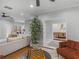 Inviting living room with plush sofa, hardwood floors, and an elegant dining room at 144 Wyckliffe Dr, Locust Grove, GA 30248