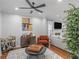 Modern living room with hardwood floors, a fireplace, and a stylish bar area at 144 Wyckliffe Dr, Locust Grove, GA 30248