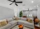 Cozy living room area with comfortable couch, natural light, and hardwood flooring at 144 Wyckliffe Dr, Locust Grove, GA 30248