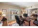 Bright home office with hardwood floors, a desk, and natural light from shuttered windows at 1535 Sheridan Ne Walk, Atlanta, GA 30324