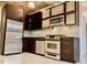 Modern kitchen with stainless steel appliances, granite countertops, and custom cabinetry at 170 Boulevard Se # E005, Atlanta, GA 30312