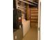 Functional laundry room includes a washer, dryer, and utility shelving for ample storage options at 170 Boulevard Se # E005, Atlanta, GA 30312