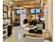 Open living space featuring exposed brick, wooden beams, modern furniture, and abundant natural light at 170 Boulevard Se # E005, Atlanta, GA 30312