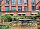 Charming outdoor seating area with a table and chairs surrounded by well-maintained landscaping at 170 Boulevard Se # E005, Atlanta, GA 30312