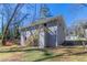 Backyard with a gray home and a wooden staircase leading to the second story at 2202 Polar Rock Sw Pl, Atlanta, GA 30315