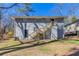 Exterior view of the back of the home with a backyard and wooden staircase at 2202 Polar Rock Sw Pl, Atlanta, GA 30315