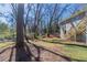 Backyard with a grassy lawn and a view of trees, with stairs on the house at 2202 Polar Rock Sw Pl, Atlanta, GA 30315