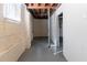 Unfinished basement showing exposed beams, painted walls and concrete floor at 2202 Polar Rock Sw Pl, Atlanta, GA 30315