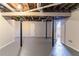 Spacious unfinished basement with support poles and room for storage or recreation at 2202 Polar Rock Sw Pl, Atlanta, GA 30315