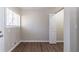 Cozy bedroom with hardwood floors, a window, and a closet with a door ajar at 2202 Polar Rock Sw Pl, Atlanta, GA 30315