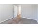 Bedroom with carpet, vertical paneling and an open door to another room at 2202 Polar Rock Sw Pl, Atlanta, GA 30315