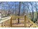 View of the deck overlooking the large backyard with mature trees at 2202 Polar Rock Sw Pl, Atlanta, GA 30315