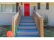 Inviting front entrance with a bright red door, gray steps, and light-colored brick at 2202 Polar Rock Sw Pl, Atlanta, GA 30315