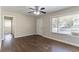 Open-concept living room featuring hardwood floors, a ceiling fan, white trim, and neutral walls at 2202 Polar Rock Sw Pl, Atlanta, GA 30315