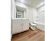 Bright bathroom featuring a large vanity, toilet, and shower/tub combo at 2407 Malster Ln, Lawrenceville, GA 30043