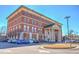 Four-story brick building with ample parking, featuring white columns and a well-maintained exterior at 2407 Malster Ln, Lawrenceville, GA 30043