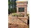 West Herrington Heights brick community entrance sign with flower bed and landscaping at 2407 Malster Ln, Lawrenceville, GA 30043