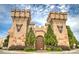 Exterior view of Medieval Times building featuring stone accents and castle-like architecture at 2407 Malster Ln, Lawrenceville, GA 30043