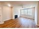 Spacious living room with LVP flooring, a fireplace, and large windows at 2407 Malster Ln, Lawrenceville, GA 30043