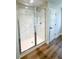 Bathroom with large walk-in shower featuring beautiful marble walls at 2407 Malster Ln, Lawrenceville, GA 30043