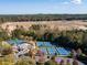 Aerial view showcases the new construction community with tennis courts and a clubhouse at 76 Lakeview Pt, Dallas, GA 30157