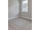 Bedroom featuring neutral paint and carpet, with a bright window at 76 Lakeview Pt, Dallas, GA 30157