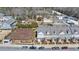 Aerial view of a neighborhood with a large fenced dog park amenity surrounded by well-maintained townhomes at 122 Brighton Blvd, Woodstock, GA 30188