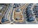 An aerial view shows neighborhood streets and green spaces, including an amphitheater and fire pit area at 122 Brighton Blvd, Woodstock, GA 30188