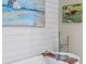 Close-up of a modern soaking tub set against a shiplap wall with a charming painting at 122 Brighton Blvd, Woodstock, GA 30188