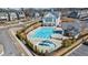 Inviting community pool featuring a spacious sun deck, splash pad and clubhouse, perfect for neighborhood recreation at 122 Brighton Blvd, Woodstock, GA 30188