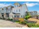 Charming townhome exterior with well-maintained landscaping and a cozy fenced-in patio at 122 Brighton Blvd, Woodstock, GA 30188