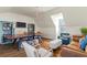 Inviting game room featuring a ping pong table, hardwood floors and a comfortable seating area for relaxation and fun at 122 Brighton Blvd, Woodstock, GA 30188