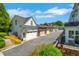 Street view of garages of homes with flower beds and nice landscaping at 122 Brighton Blvd, Woodstock, GA 30188