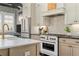 A well-equipped kitchen features stainless steel appliances and sleek countertops, perfect for cooking and entertaining at 122 Brighton Blvd, Woodstock, GA 30188