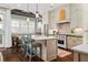 Charming kitchen with a center island, stainless steel appliances, and white cabinetry offers an open living space at 122 Brighton Blvd, Woodstock, GA 30188