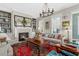 Comfortable living room with fireplace, built-in shelves, and plentiful natural light at 122 Brighton Blvd, Woodstock, GA 30188