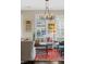 Charming living room featuring hardwood floors, decorative chandelier, and cozy furnishings at 122 Brighton Blvd, Woodstock, GA 30188