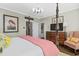 Cozy main bedroom with natural light, patterned accents, and a four poster bed at 122 Brighton Blvd, Woodstock, GA 30188
