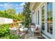 Cozy patio setup with comfortable furniture, scenic garden views, and a welcoming ambiance at 122 Brighton Blvd, Woodstock, GA 30188