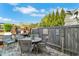Cozy outdoor patio featuring brick pavers, stylish wicker furniture and a wooden fence surround at 122 Brighton Blvd, Woodstock, GA 30188