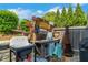 Outdoor potting area with work sink, flowers and grill, ideal for gardening and grilling at 122 Brighton Blvd, Woodstock, GA 30188