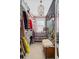 Spacious walk-in closet with organized storage and a decorative floral wall at 122 Brighton Blvd, Woodstock, GA 30188