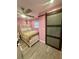 Comfortable bedroom featuring stylish closet doors, ceiling fan, and neutral colors at 172 Scarsdale Dr, Riverdale, GA 30274
