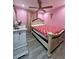 Stylishly decorated bedroom features modern ceiling fan, neutral colors, and wood floors at 172 Scarsdale Dr, Riverdale, GA 30274