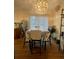 Bright dining area featuring a modern chandelier and sliding door to the outside at 172 Scarsdale Dr, Riverdale, GA 30274