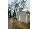 View of a single-Gathering residence with a detached garage and yard at 172 Scarsdale Dr, Riverdale, GA 30274